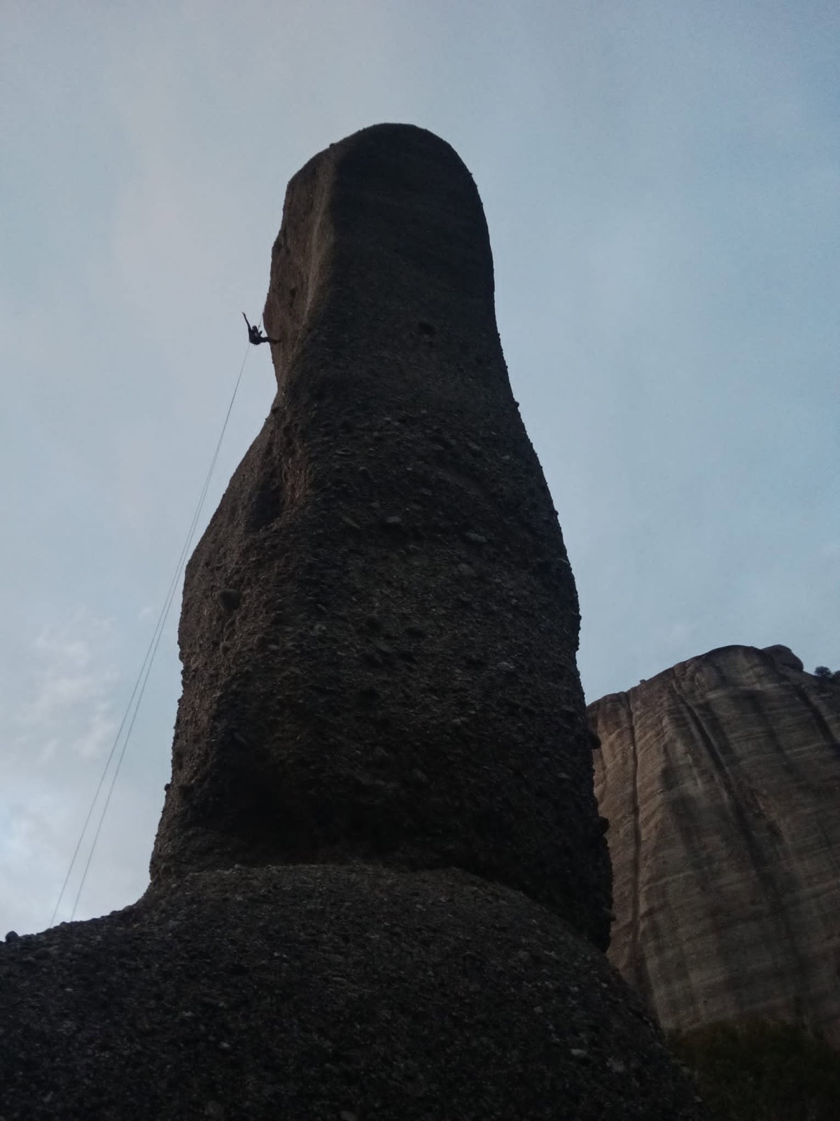 Climbing a rock spire at dusk
